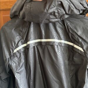 Lululemon wind breaker coat with front zip pockets and drawstring at bottom